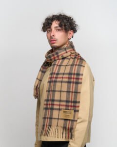 A father draping a grey cashmere scarf over his shoulders.